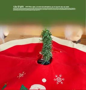 Detailed embroidery of Santa Claus and snowflakes on red velvet Christmas tree skirt
