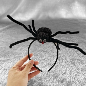 Halloween spinnenhoofdband in zwart met glitters en pluche poten voor kostuumfeest