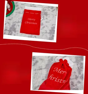 Macro detail of red velvet Christmas gift bag with white Merry Christmas embroidery