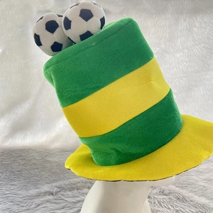 Detail view of a green and yellow striped plush soccer fan hat with mini football decorations