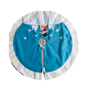 Blue Christmas tree skirt with plush white trim, featuring snowman and snowflake embroidery