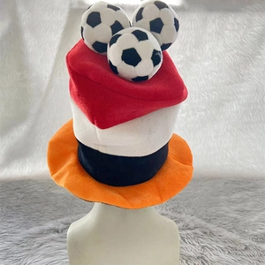 Detailed view of the soccer plush party hat with white, red, and black tiered fabric layers