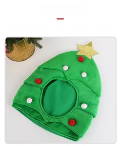 Detail view of festive green Christmas tree pet hat with colorful balls and gold star