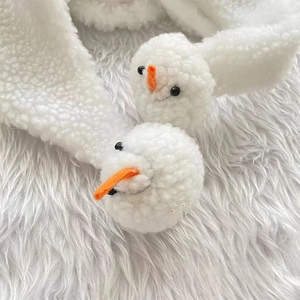 White plush Christmas hat with cute snowman decorations for festive winter holiday costumes