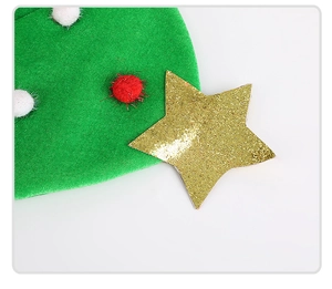 Detail of green velvet Christmas tree hat with gold glitter star and colorful pom-poms