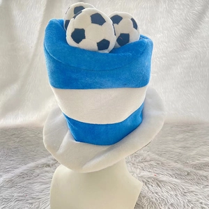 Macro shot of blue and white striped plush fan hat featuring three mini football models