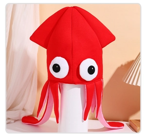 Detail of red velvet squid hat with large white eyes and plush tentacles for party