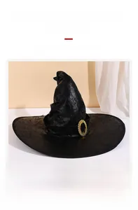 Detail of faux suede witch hat showing vintage texture and golden decorative buckle