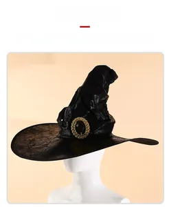 Detail of black witch hat featuring cracked texture fabric and golden metallic buckle