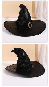 Detail view of the black wizard hat with cracked leather texture and vintage gold buckle