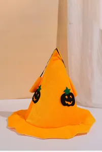 Detailed view of an orange pumpkin wizard hat with black smiling face for Halloween parties