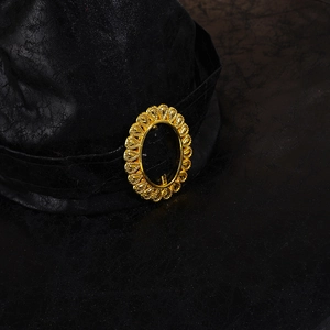 Black witch hat featuring cracked leather texture and vintage golden embossed buckle detail