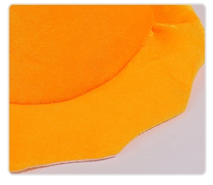 Detailed macro view of vibrant orange plush fabric texture on a Halloween pumpkin hat