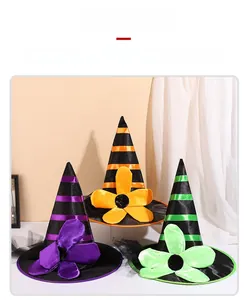 Detailed view of Halloween witch hats with colorful flowers and satin finish