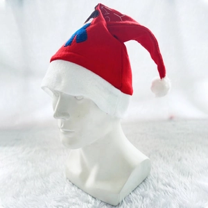 Classic red and white festive Christmas hat with soft plush trim and cute cartoon patch