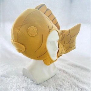 Detailed view of yellow taiyaki plush hat with stitched scale patterns and soft fin details