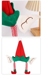 Detail of red and green Christmas elf hat with pointed ears and striped long legs