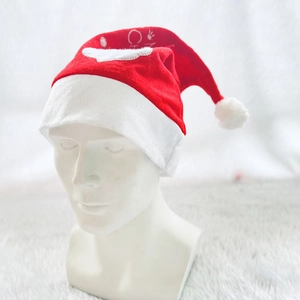 Classic red velvet Santa hat with plush white trim and embroidered Merry Christmas text
