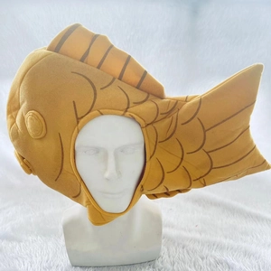 Detailed view of yellow taiyaki plush headgear with fish scale stitching and soft texture