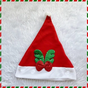 Classic red Christmas hat with white plush trim, green sequin antlers and a red bow
