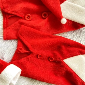 Detailed macro view of soft plush Christmas wine bottle covers with red buttons and hats