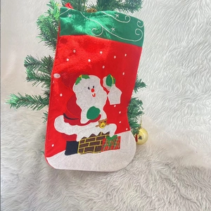 Classic large Christmas stocking featuring Santa Claus embroidery on a plush white background