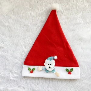 Red Christmas hat featuring a cute white teddy bear with green holly leaf details