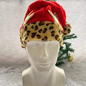 Festive red Christmas hat featuring golden antlers and stylish leopard print trim details