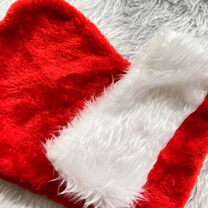 Classic red and white plush Christmas hat with soft fur trim for holiday decorations