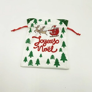 Detail of Christmas drawstring gift bag with Santa Claus illustration and Joyeux Noël text