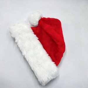 Detail view of plush white faux fur trim and soft red velvet fabric on a Christmas hat