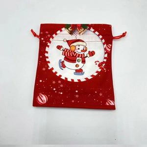Red Christmas drawstring gift bag with a cute skating snowman pattern for holiday presents