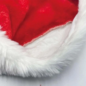 Close-up of internal red stitching and plush white faux fur lining on a Christmas hat