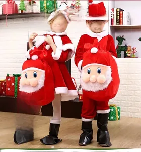 Kids holding large red velvet Santa Claus drawstring gift bag for festive decoration