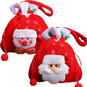 Christmas drawstring gift bags featuring Santa and Snowman designs in festive red fabric
