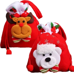 Detailed view of red plush Christmas gift bags with 3D reindeer and polar bear designs