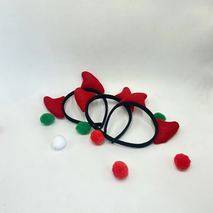Three red ox horn devil headbands for Halloween party with colorful decorative pom poms
