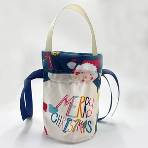 Blue Christmas gift bag with Merry Christmas print and drawstring handle for candy