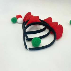 Halloween devil horn headband set with red plush horns and festive colorful pom poms