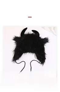 Detailed view of the plush black devil horn hat with warm faux fur and tie-up chin straps