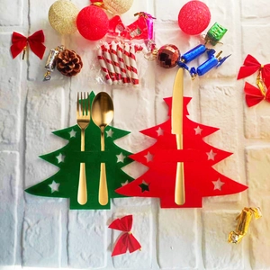 Christmas tree shaped felt cutlery holders in red and green for holiday table decoration