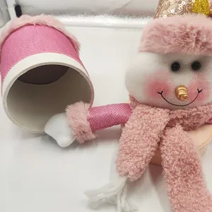 Close-up of pink snowman candy jar with thick barrel body and plush decorative hat