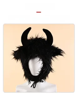 Front view of black plush devil horn hat with ear flaps and straps on a white model