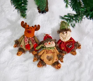 Close-up of Christmas gift bags featuring reindeer and snowman with transparent heart window