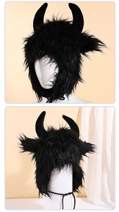Close-up of black plush bull horn hat with faux fur texture and side view on head model