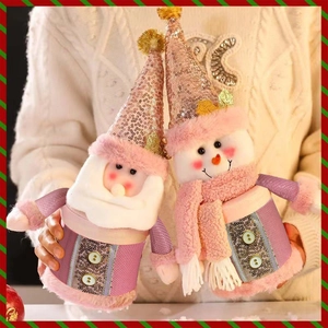 Pink plush Christmas candy jars featuring Santa Claus and snowman with sparkling hats