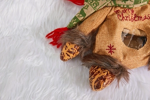 Detail of Christmas candy bag with Merry Christmas embroidery and linen texture
