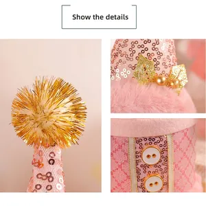 Pink sequin Christmas hat with gold tassel, faux fur trim and buttons for holiday party