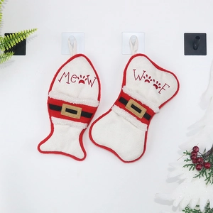 Christmas stockings set with fish and bone shapes for pets featuring festive red and white plush