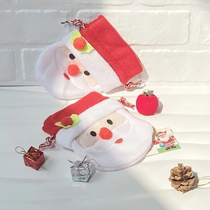 Detail shot of Santa Claus gift bag with drawstring and plush fabric texture